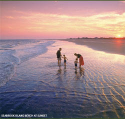 A couple with children on the beach at Seabrook Island, SC